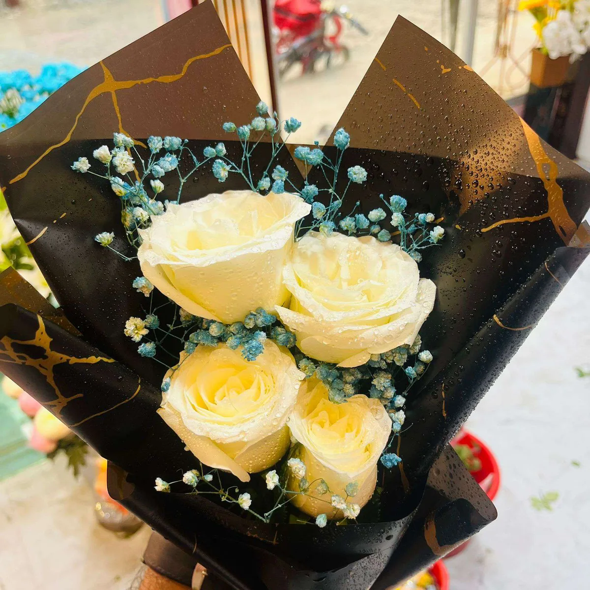 A Pure Love White Roses in Black & Gold Wrap Bouquet